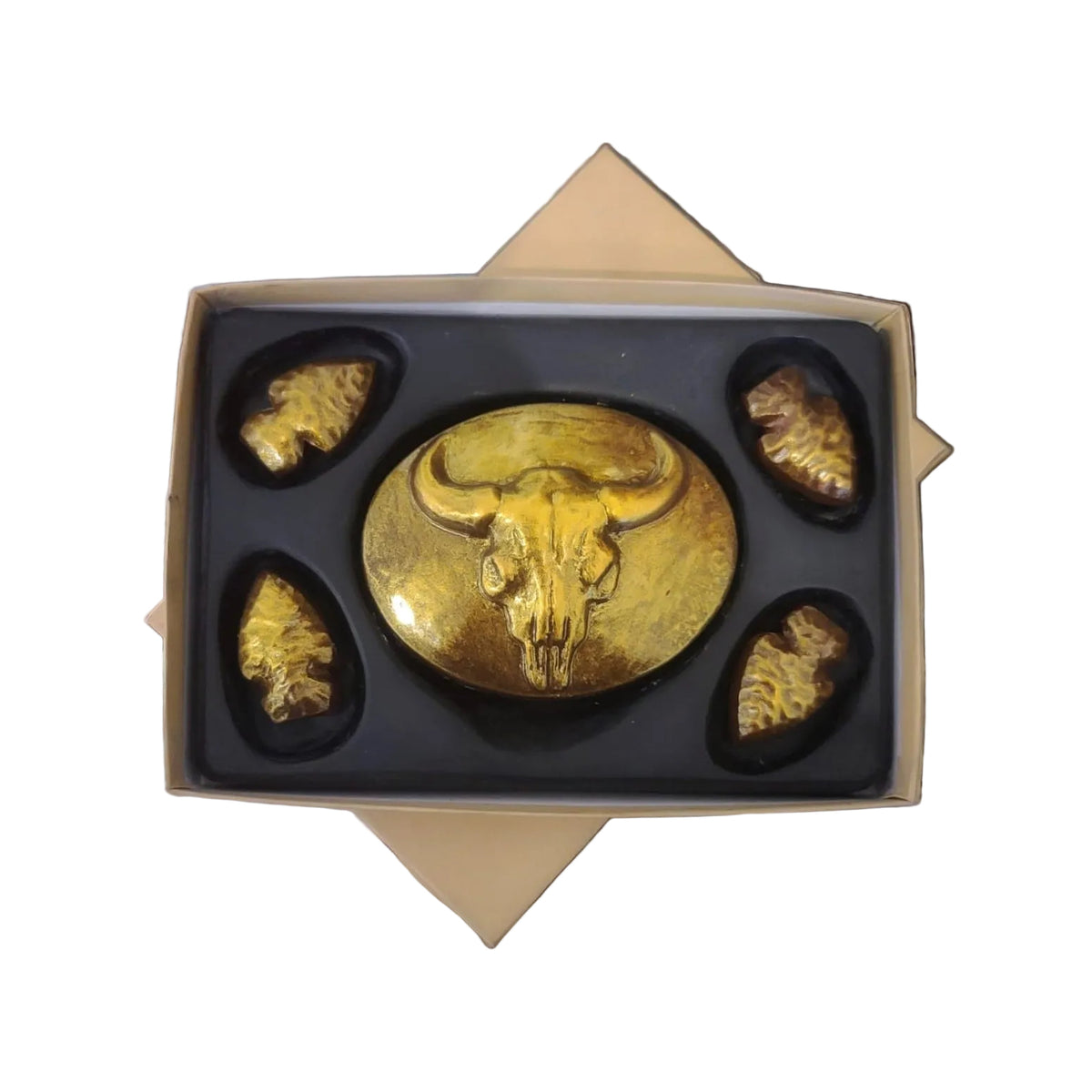 Gold chocolate bar with bull skull design and arrowheads, made in Bozeman, Montana