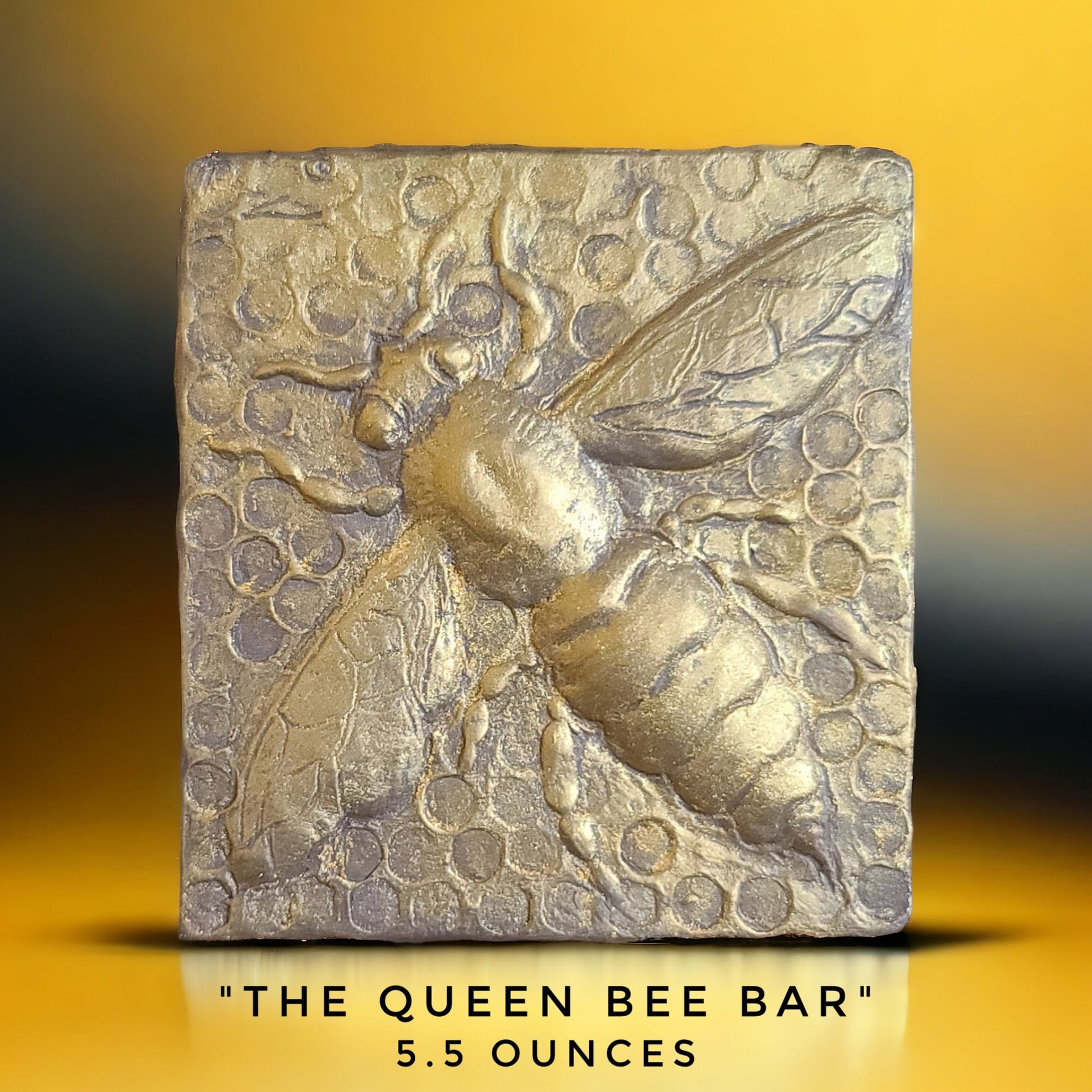 Chocolate bar with bee and honeycomb design, labeled 'The Queen Bee Bar', made in Bozeman, Montana